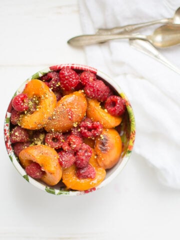 Melted Apricots with Fresh Raspberries and Pistachio Dust. It's an easy, no-sugar dessert recipe that's perfect for early summer.