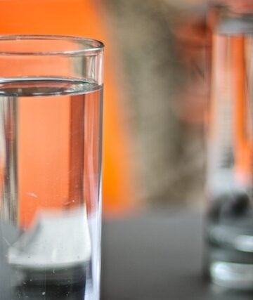Glass of water on a black table