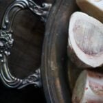 Cross-cut marrow bones on a silver platter.