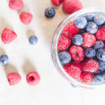 raspberries and blueberries in a jar
