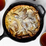 Apple Dutch Baby Pancake Dusted with Powdered Sugar and Served with Tea