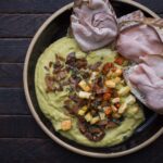 meat on bread with hummus and seasonings
