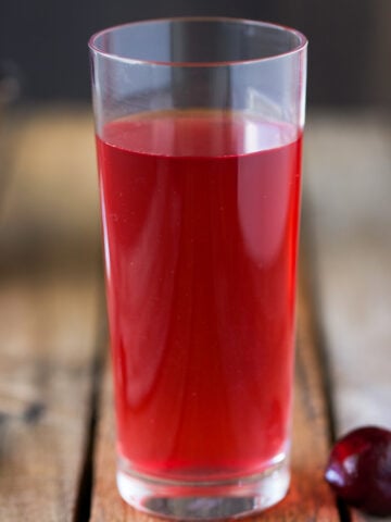 cherry elixer in a cup