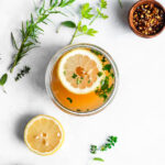 turkey bone broth garnished with herbs and lemon