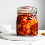 Daikon radish kimchi in a Fido jar on a marble serving tray