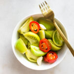 fermented green tomatoes in a bowl