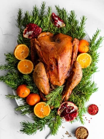 Maple-Brined Turkey on Bed of Rosemary Garnished with Pomegranates and Oranges