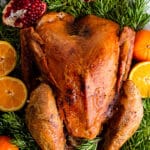 Maple-Brined Turkey on Bed of Rosemary Garnished with Pomegranates and Oranges