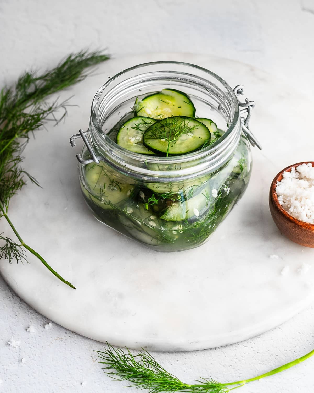 Finnish-style shaken quick pickles in a jar with fresh dill.